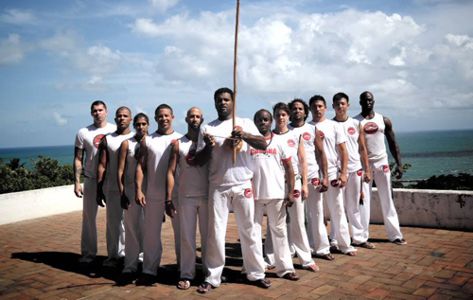 Worldwide Instructors of Capoeira Camara (Mestre Bola in Front – Ivan Outerbridge on left shoulder)