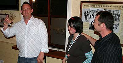 Gordon Carnie and Channelle award trophy to the Invercargill men’s team.